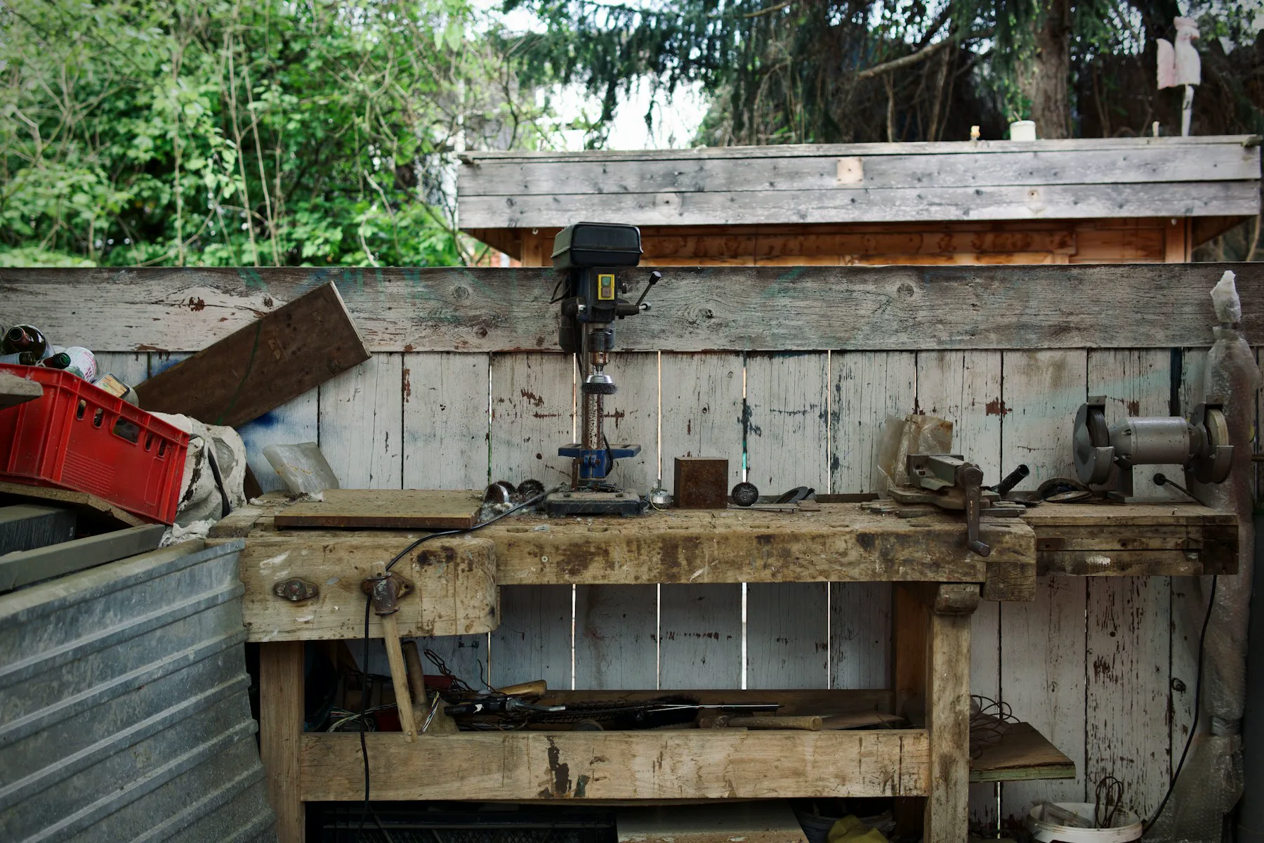 Hand tools arranged on a timber workbench