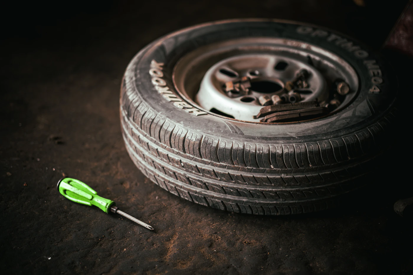 A tyre and hand tools in an automotive workshop